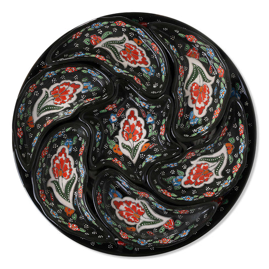 Set of ceramic snack serving trays  with floral patterns on a black background