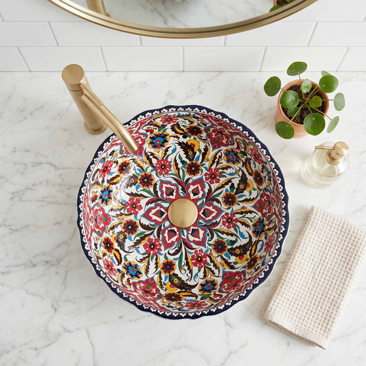 Decorative sink with floral pattern on a marble countertop
