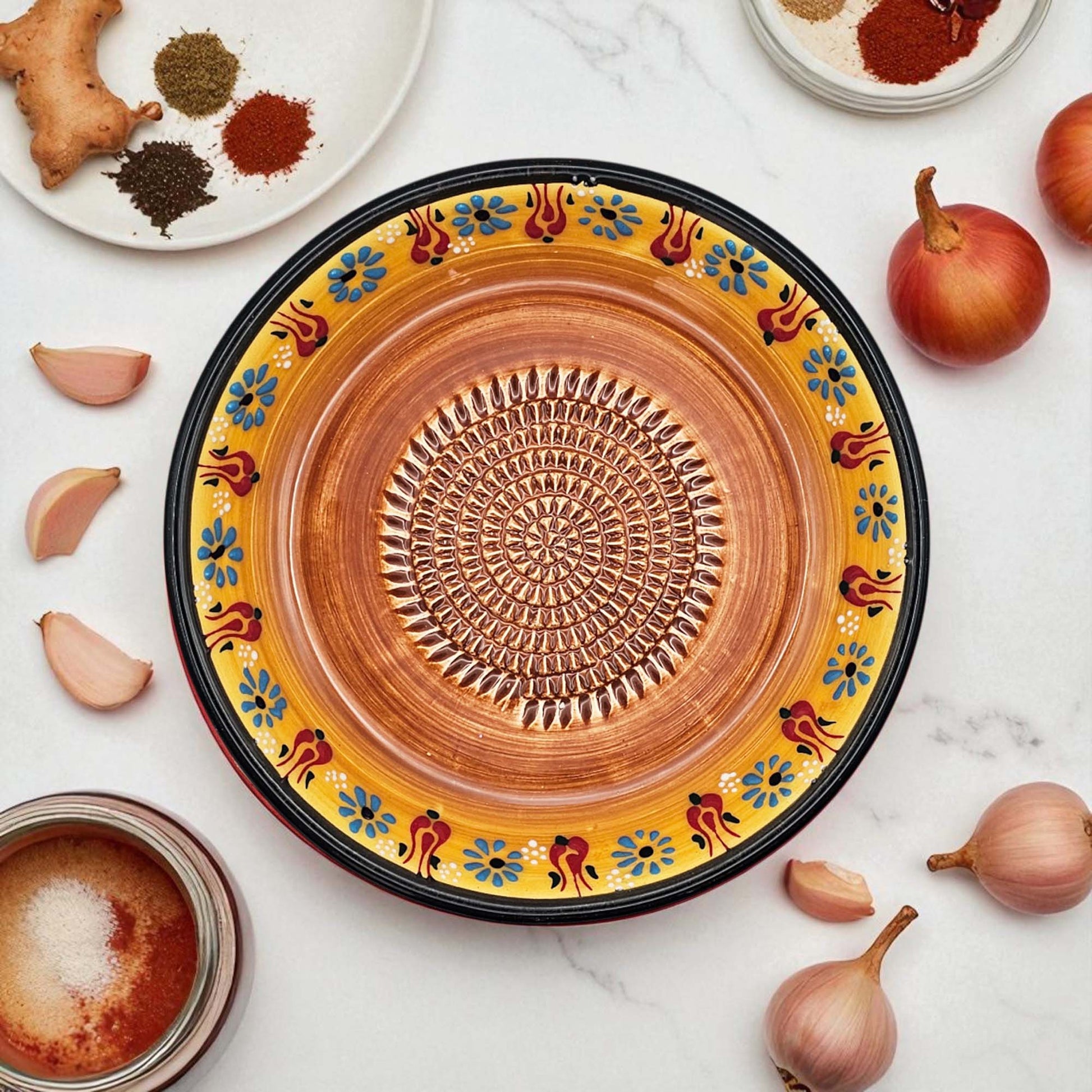 Handmade ceramic garlic grater bowl in Saffron Petals design. Large 7” size, perfect for garlic, ginger & spices. Bright artisan style, dishwasher safe.