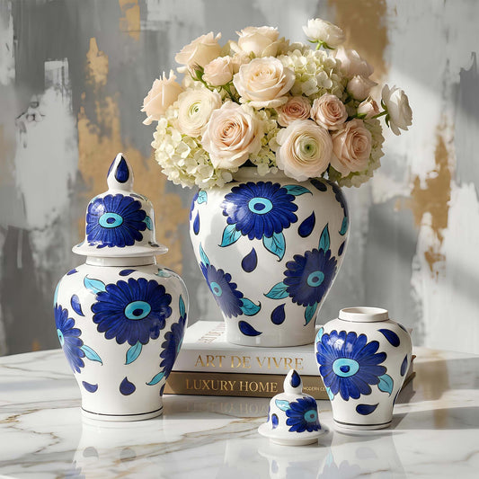 Decorative jars with blue floral patterns on a marble surface