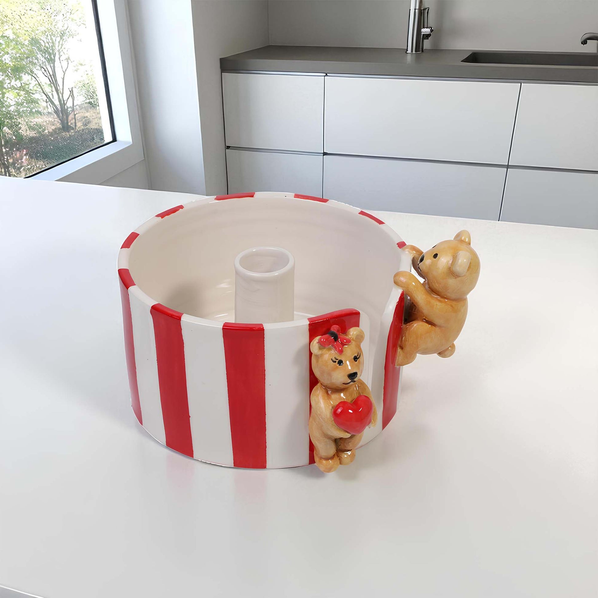 Decorative paper towel holder with teddy bears on a kitchen counter