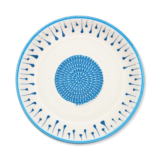 Ceramic garlic grater bowl with blue decorative pattern on a white background