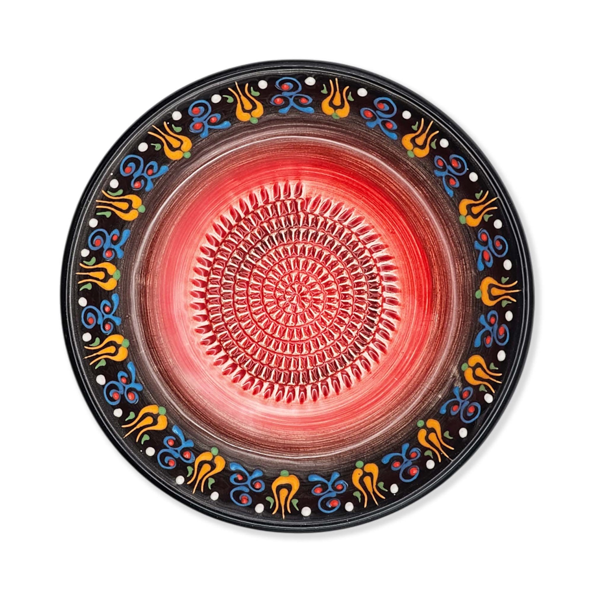 Decorative garlic grater bowl with a colorful border on a white background