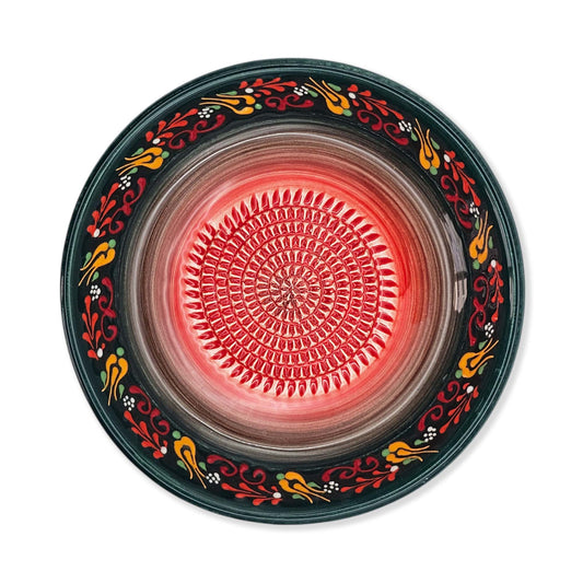 Decorative garlic grater bowl with colorful floral patterns on a white background