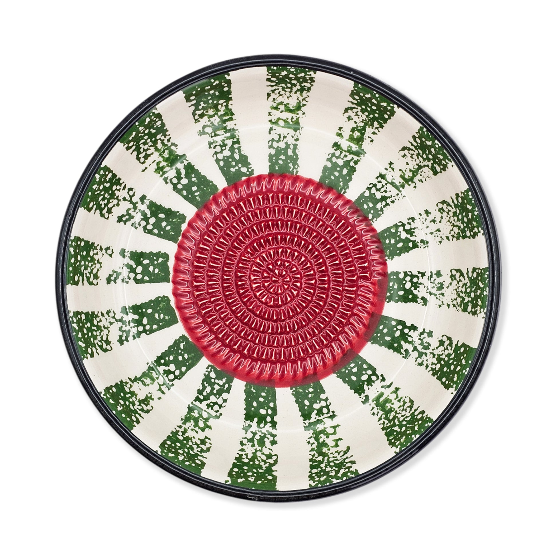 Round garlic grater bowl with a red center and green and white patterned rim on a white background
