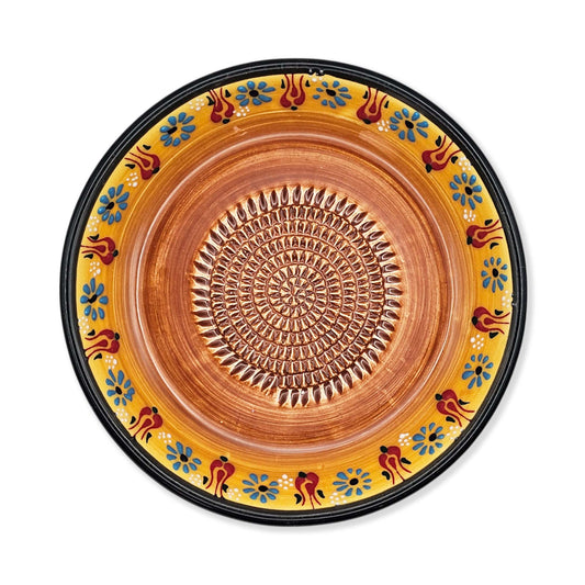 Handmade ceramic garlic grater bowl in Saffron Petals design. Large 7” size, perfect for garlic, ginger & spices. Bright artisan style, dishwasher safe.