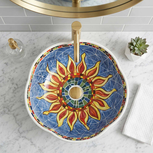 Decorative ceramic sink with sunflower design on a marble countertop