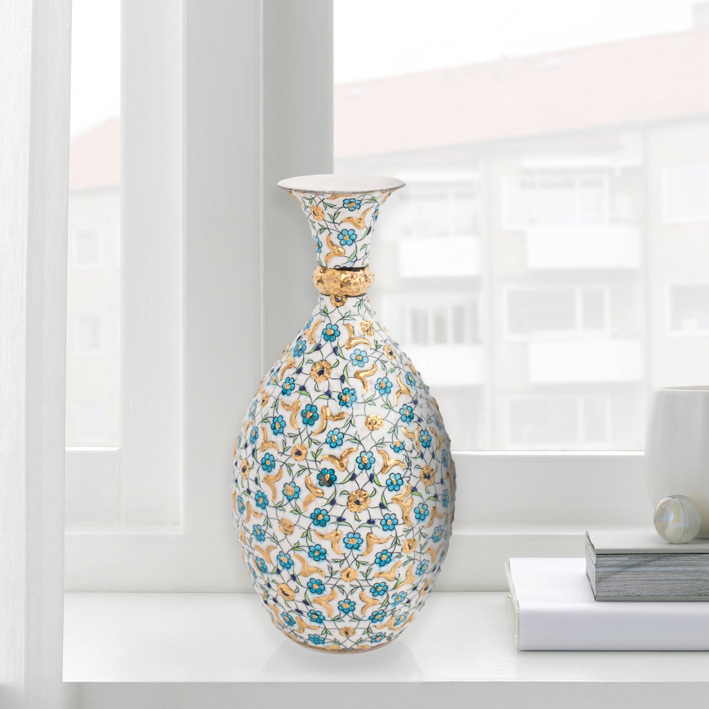 Hand-painted ceramic decorative bottle with turquoise and gold floral motifs on ivory. Glossy artisan vase, elegant décor accent, perfect for gifting.