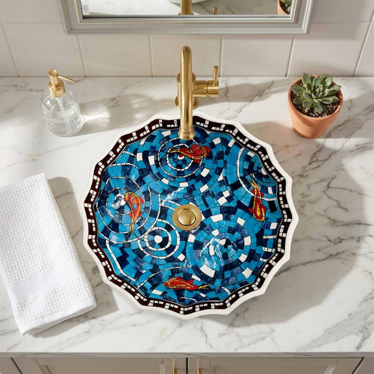 Decorative ceramic sink with gold fixtures on a marble countertop