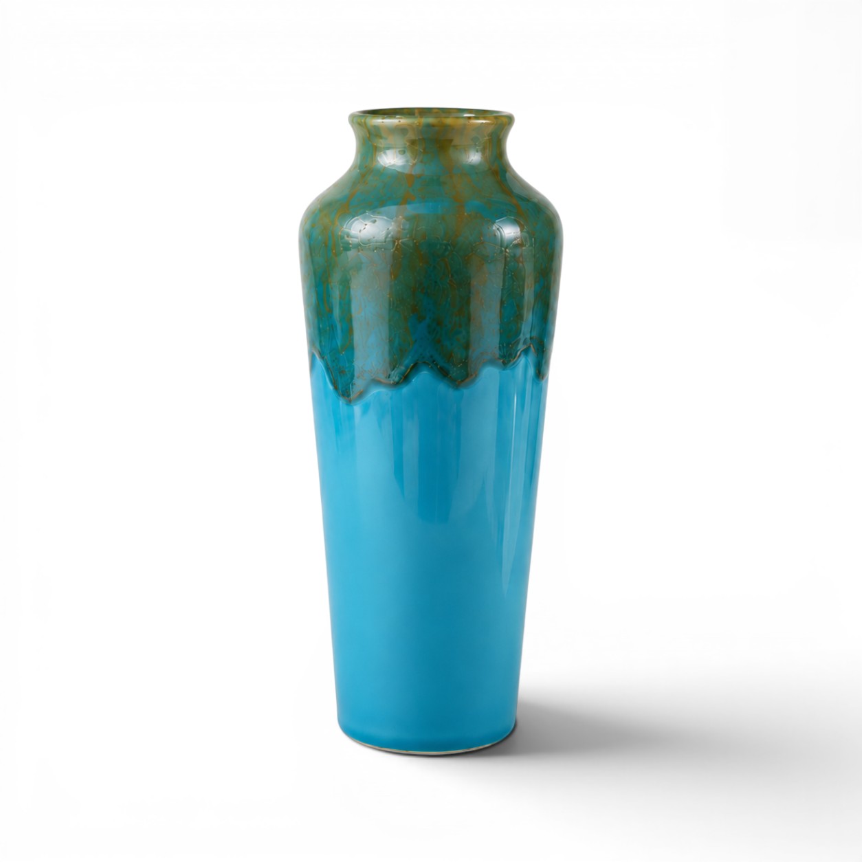 Tall ceramic vase with blue and green gradient on a white background