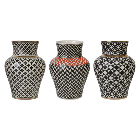 Three decorative ceramic vases with geometric patterns on a white background
