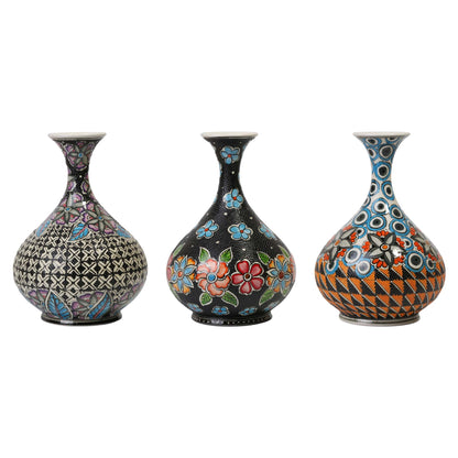 Three decorative vases with intricate patterns on a white background