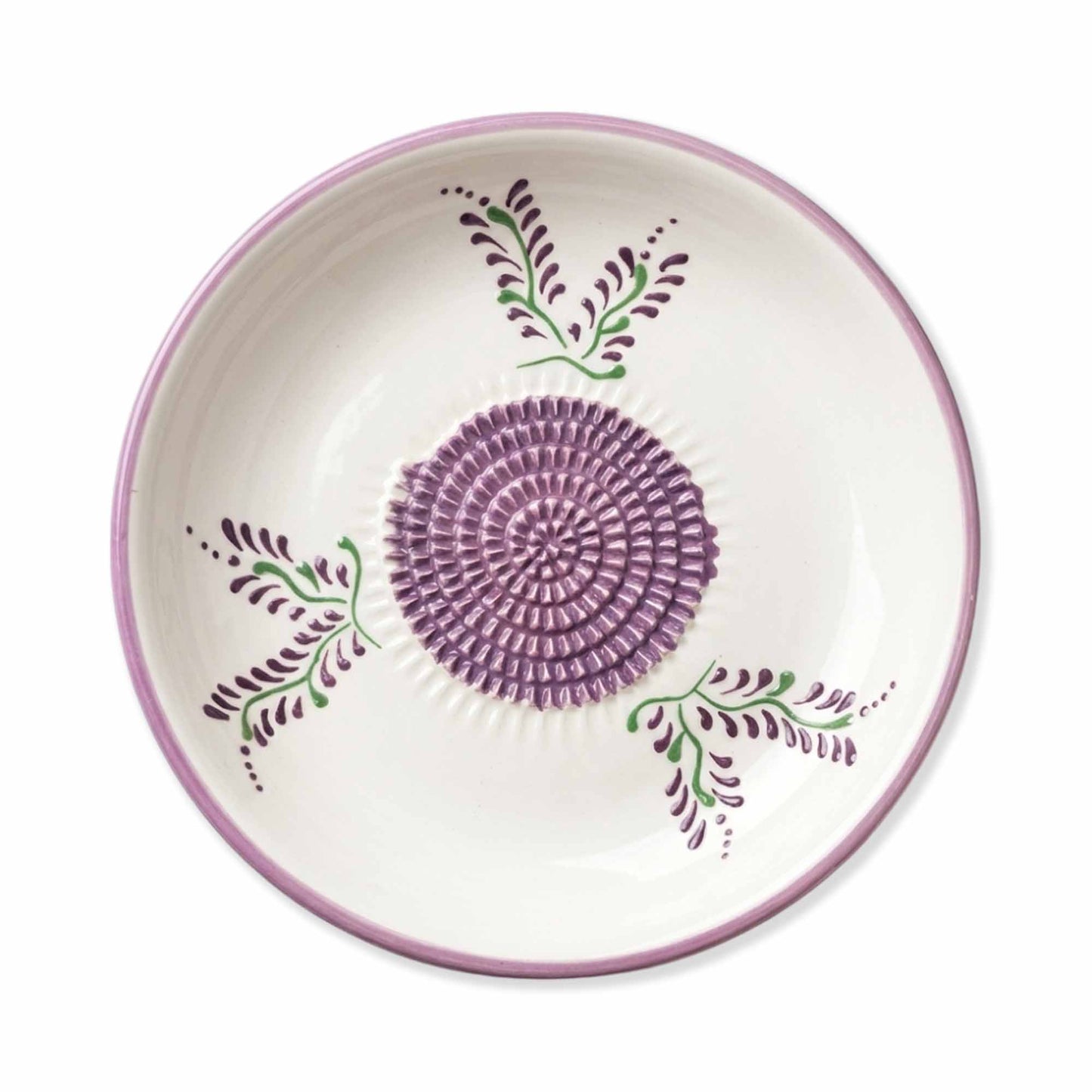 Ceramic gralic grater bowl with purple floral design on a white background
