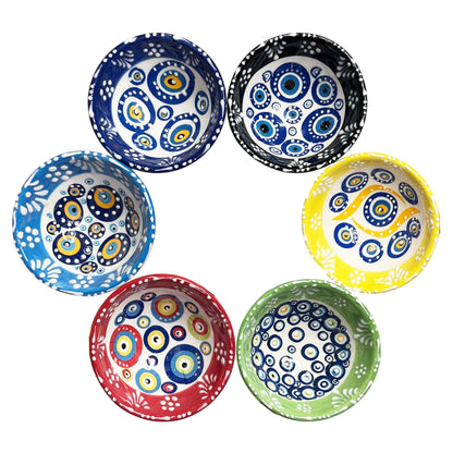 Set of six colorful ceramic bowls with circular patterns on a white background