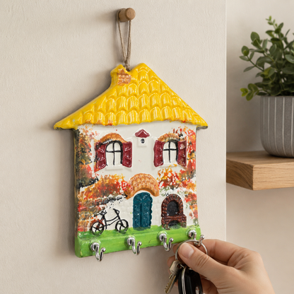 Sunshine yellow roof ceramic key organizer in a cozy winter hallway