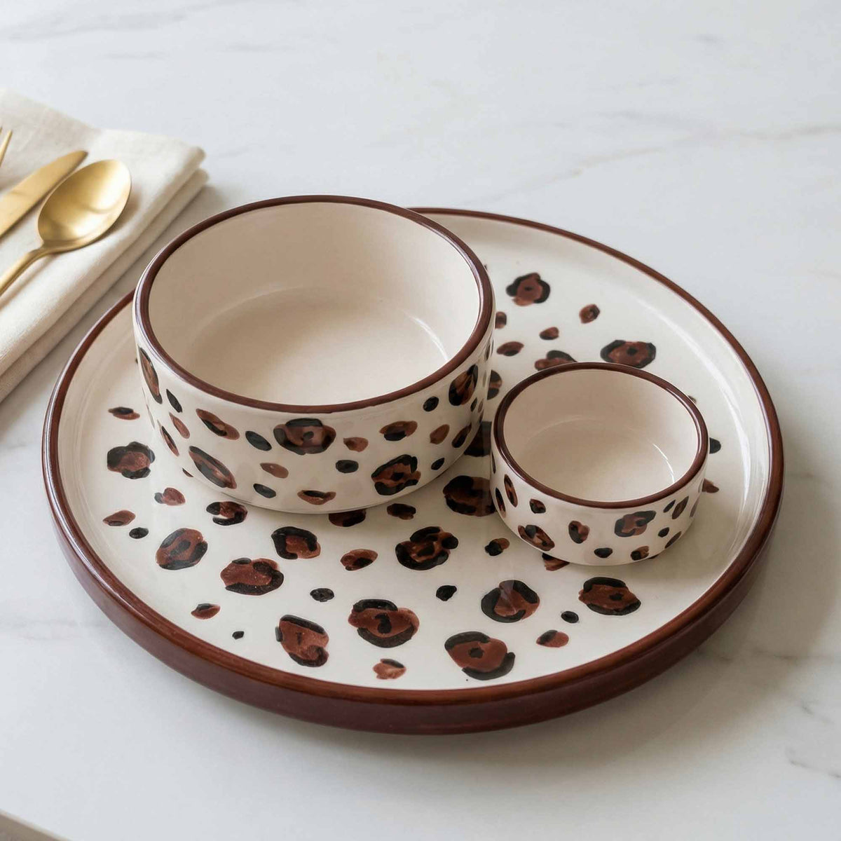 Ceramic tableware set with coffee seeds design on a white surface