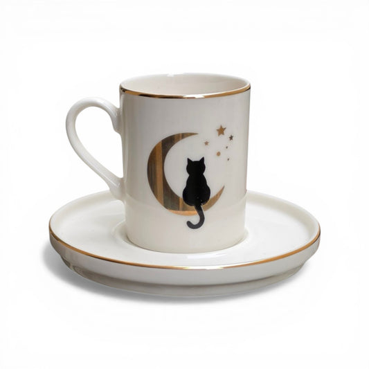 Porcelain cup and saucer with a black cat design on a white background