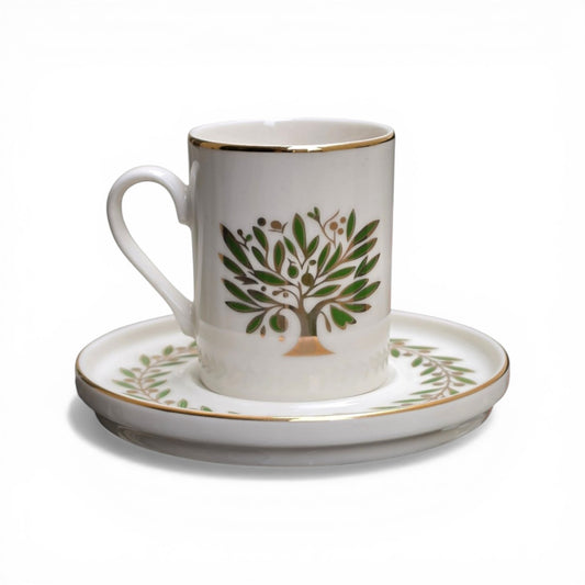 Porcelain cup and saucer with a tree design on a white background