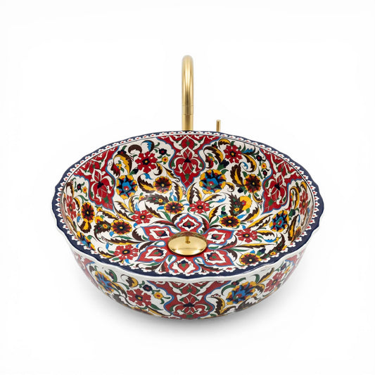 Decorative ceramic sink with floral patterns on a white background