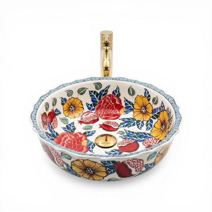 Decorative ceramic sink with floral patterns on a white background