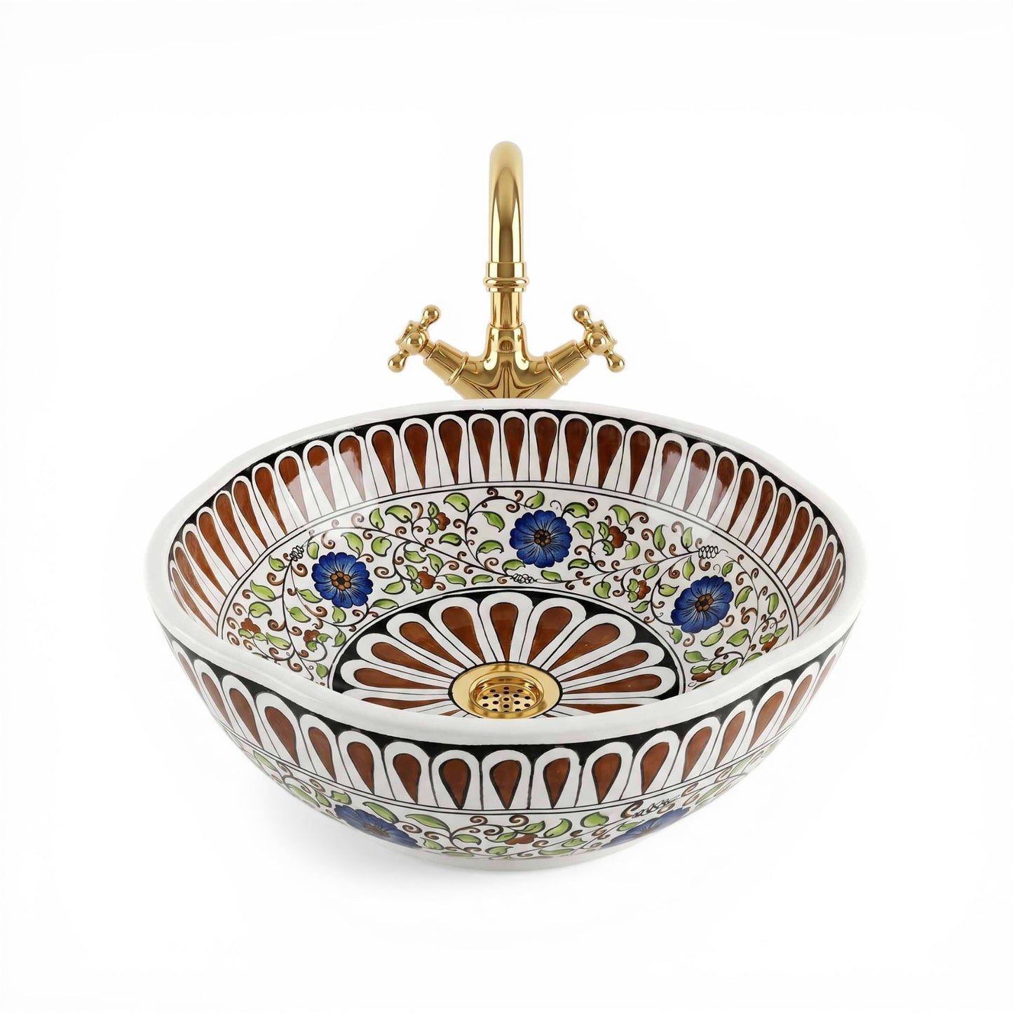 Decorative ceramic sink with floral patterns and a gold faucet on a white background