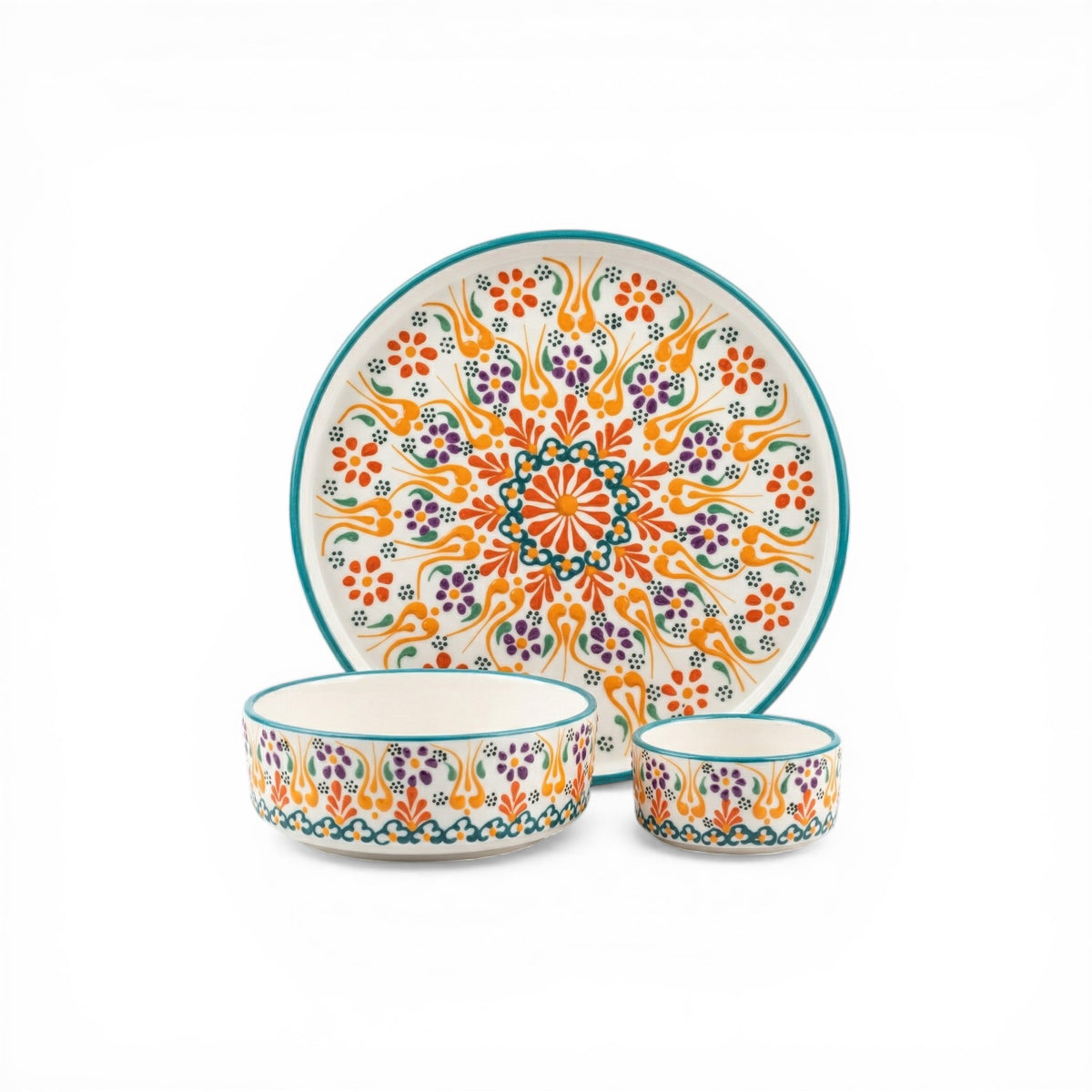 Ceramic dinnerware set with colorful floral patterns on a white background