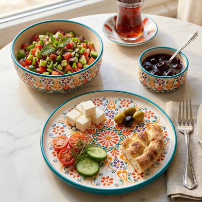 Colorful ceramic plates with food on a marble surface