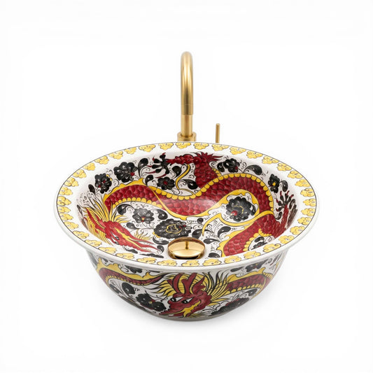 Decorative ceramic sink with artistic design on a white background