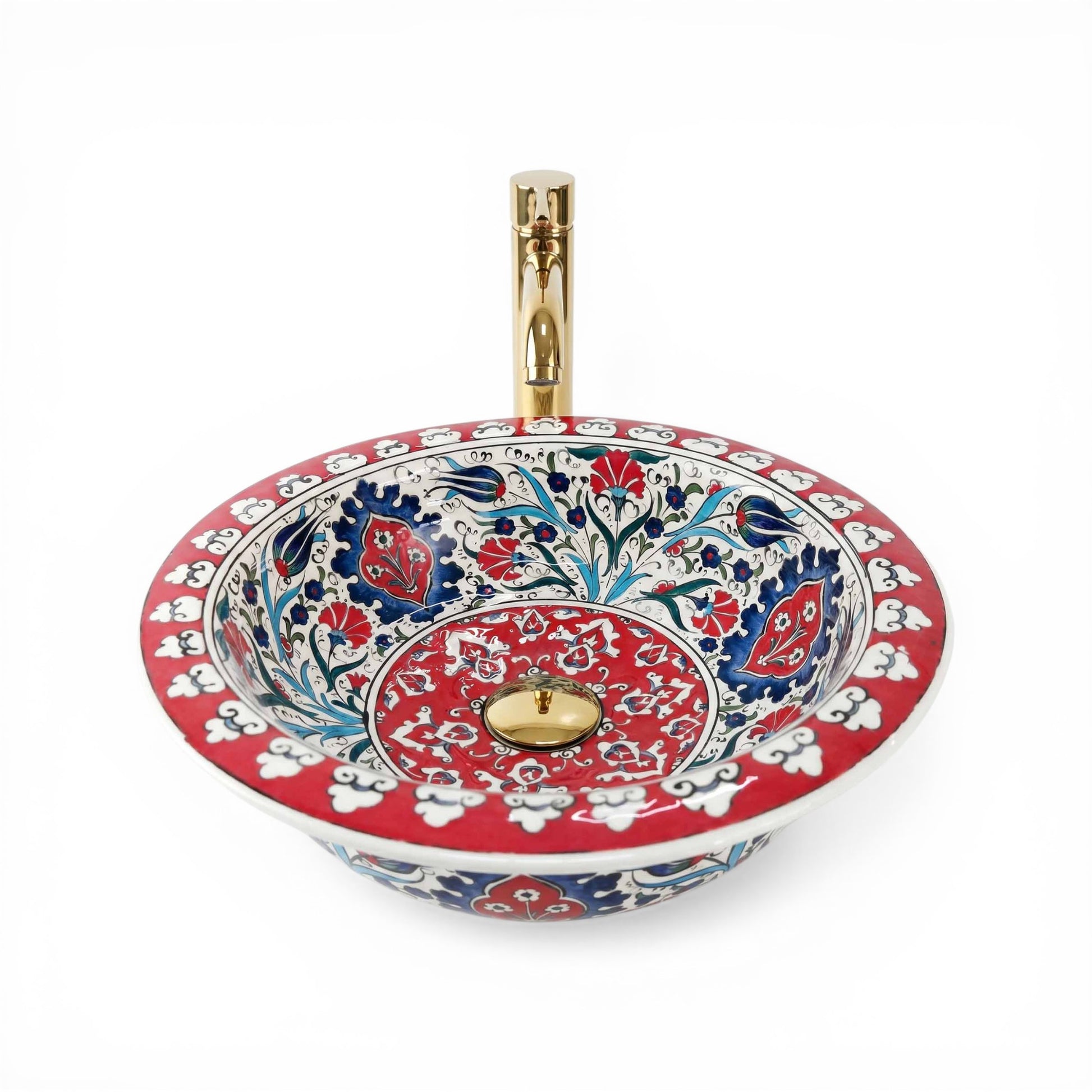 Decorative ceramic sink with floral patterns and gold accents on a white background