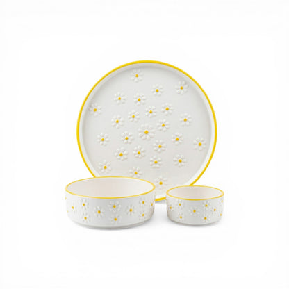 Ceramic dinnerware set with yellow accents on a white background