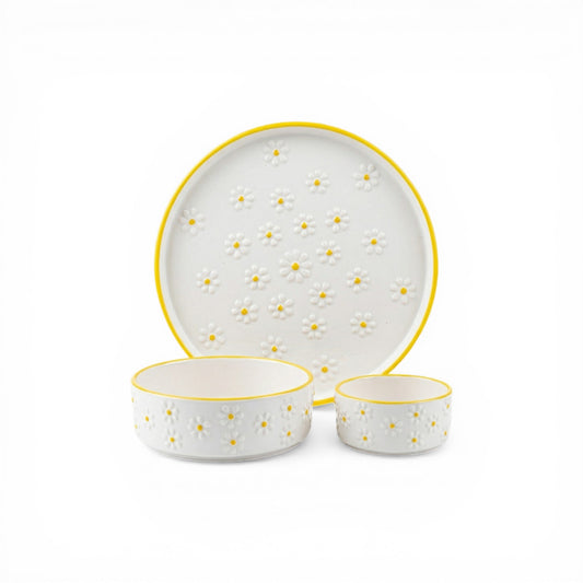 Ceramic dinnerware set with yellow accents on a white background