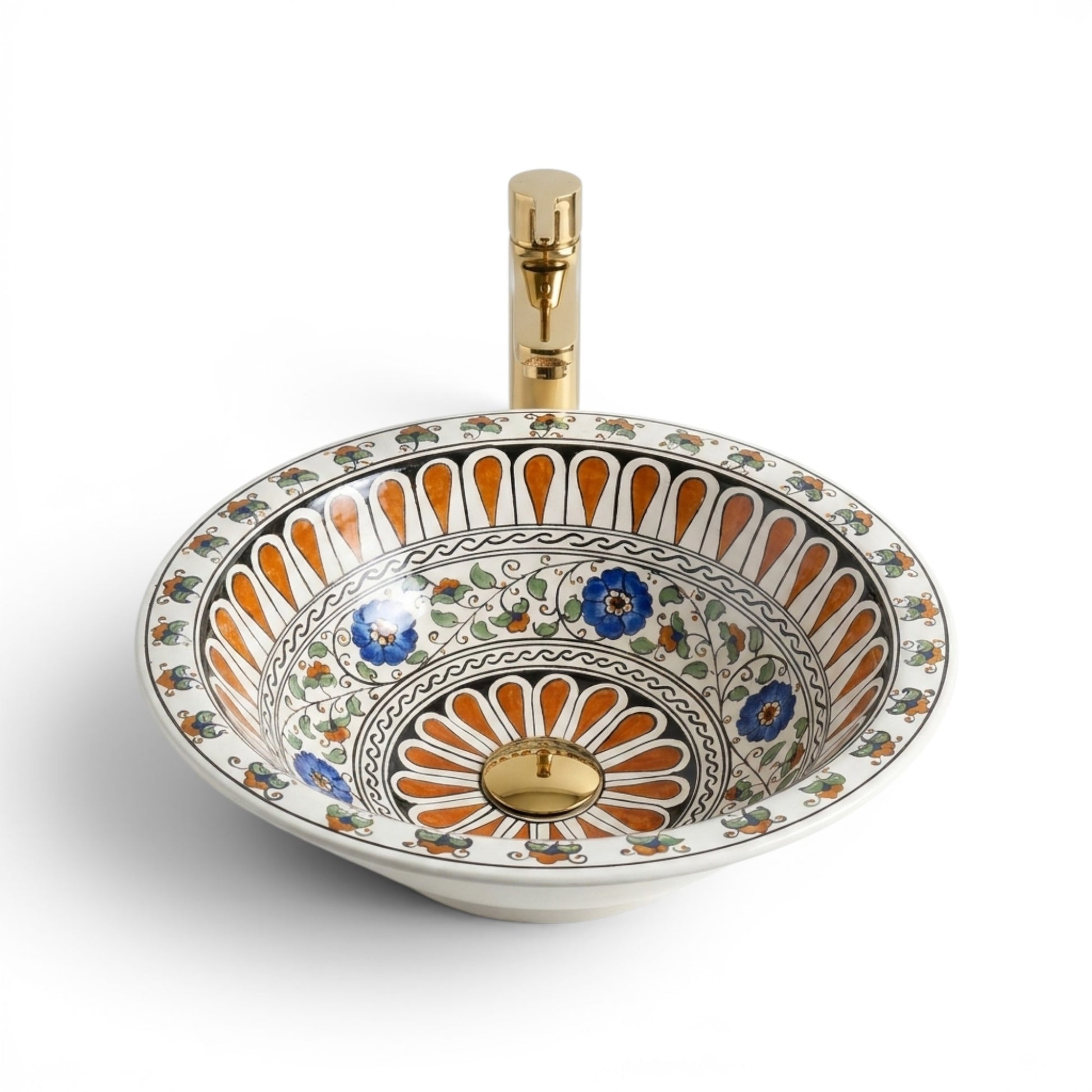 Decorative ceramic sink with floral patterns and a gold faucet on a white background