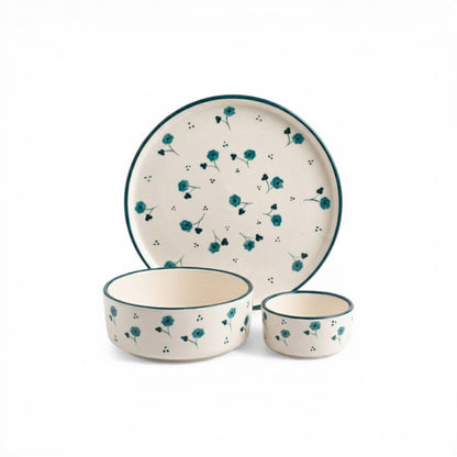 Ceramic dinnerware set with floral pattern on a white background