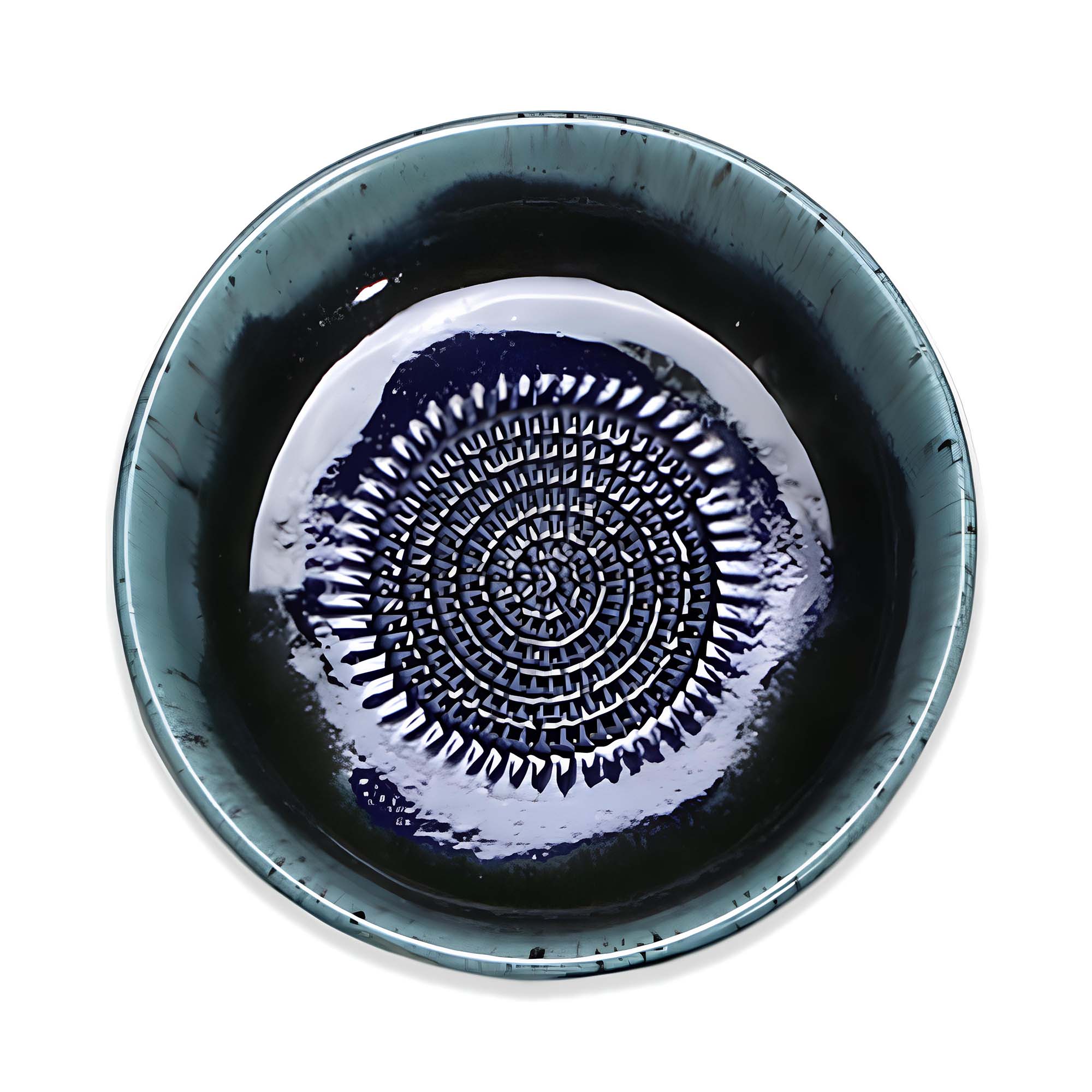 Ceramic garlic grater bowl with decorative pattern on a white background
