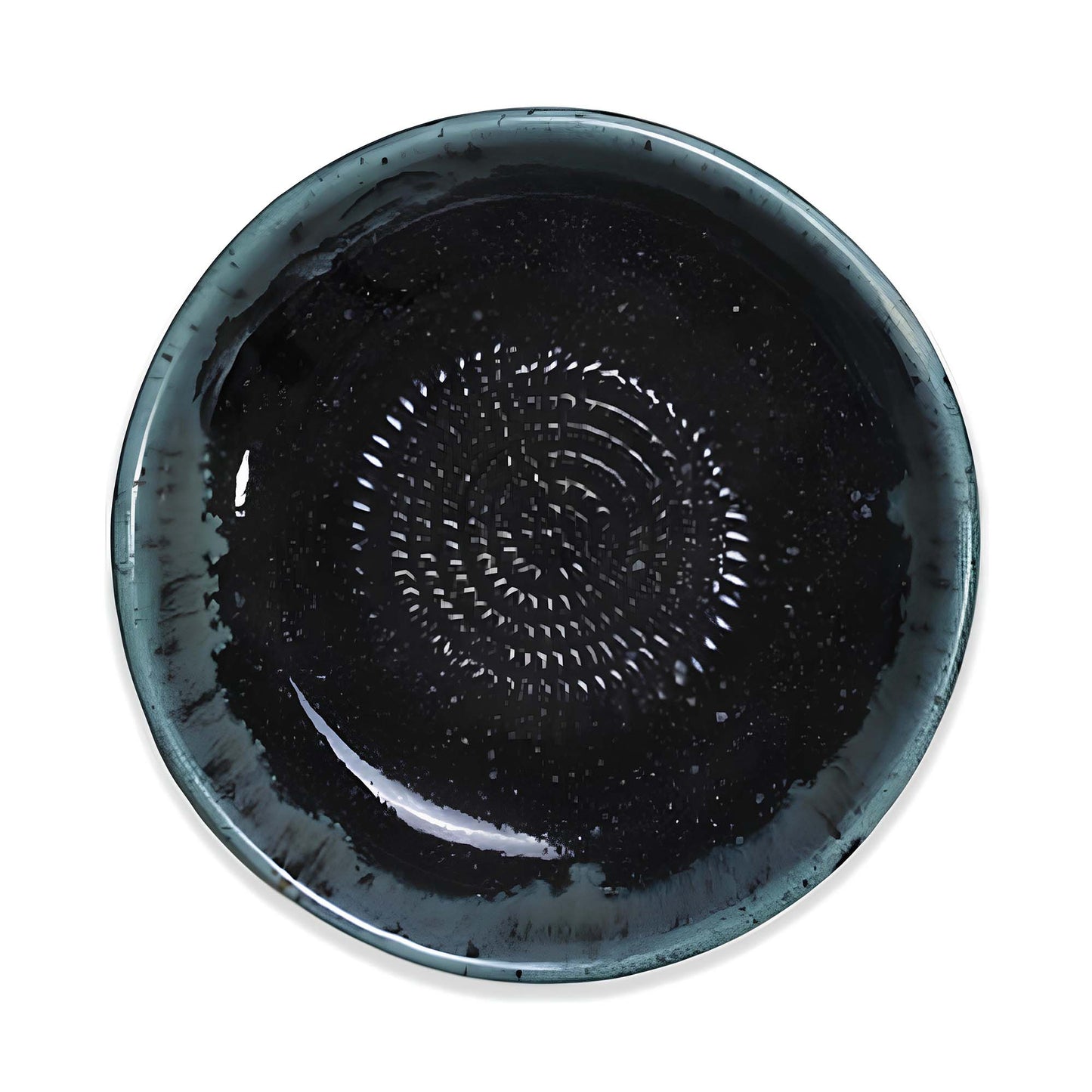 Black ceramic garlic grater bowl with a textured design on a white background