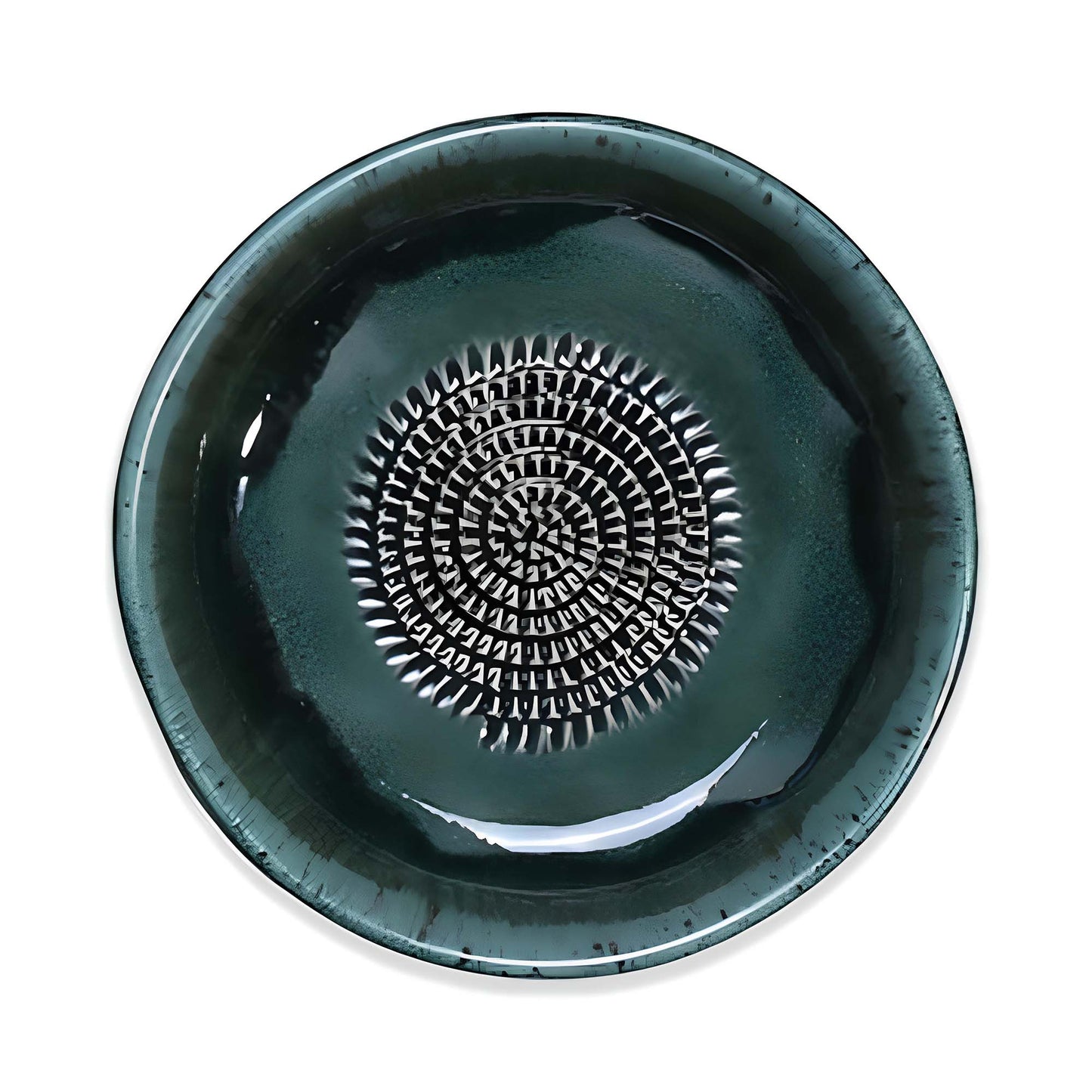 Green ceramic garlic grater bowl with a textured center design on a white background