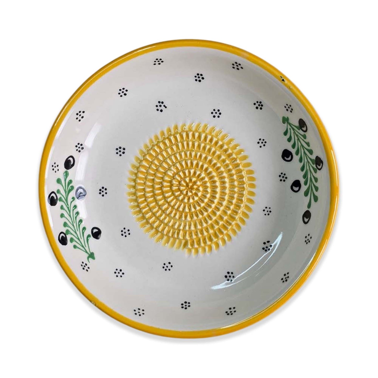 Ceramic garlic grater bowl with yellow center and decorative patterns on a white background