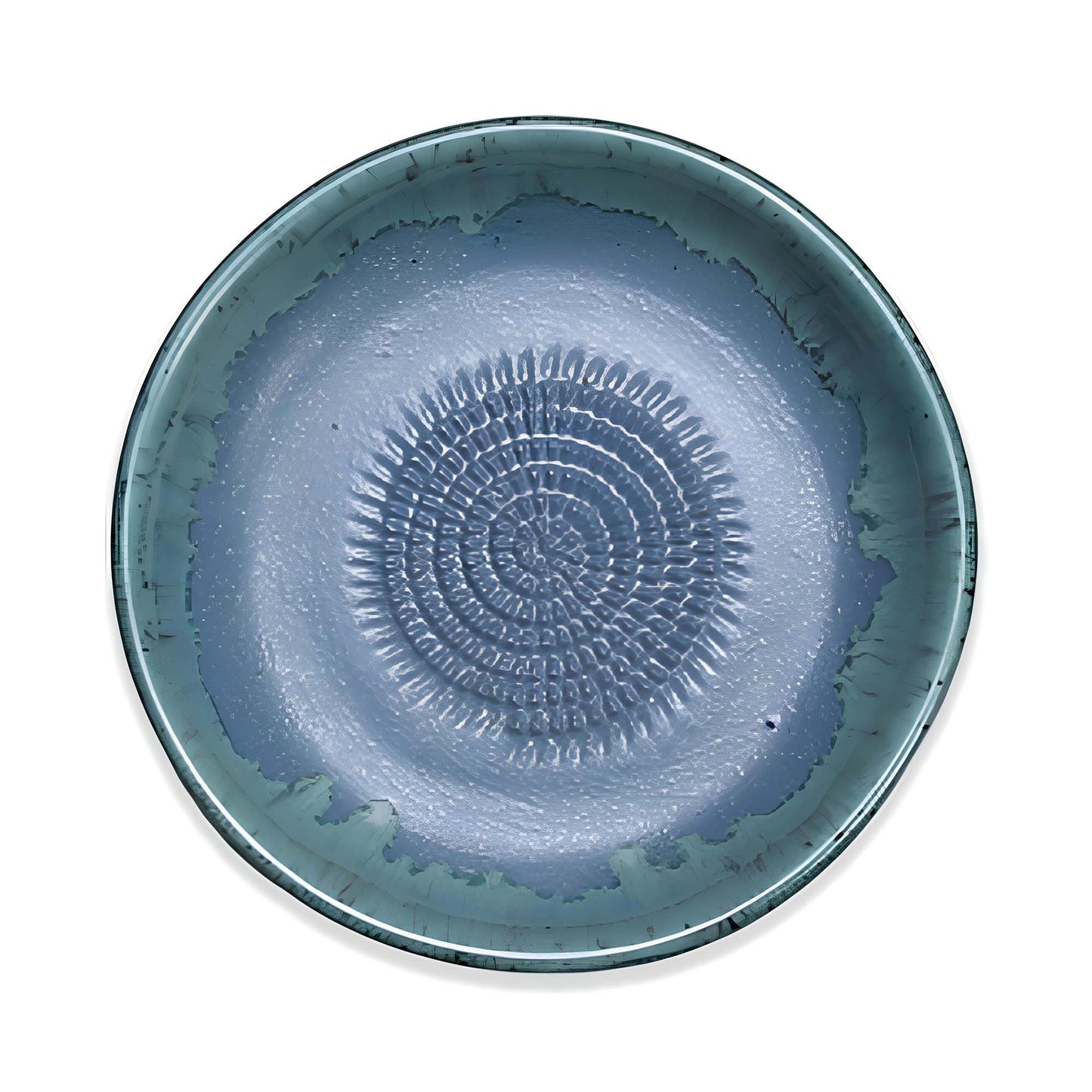 Blue ceramic garlic grater bowl with textured design on a white background