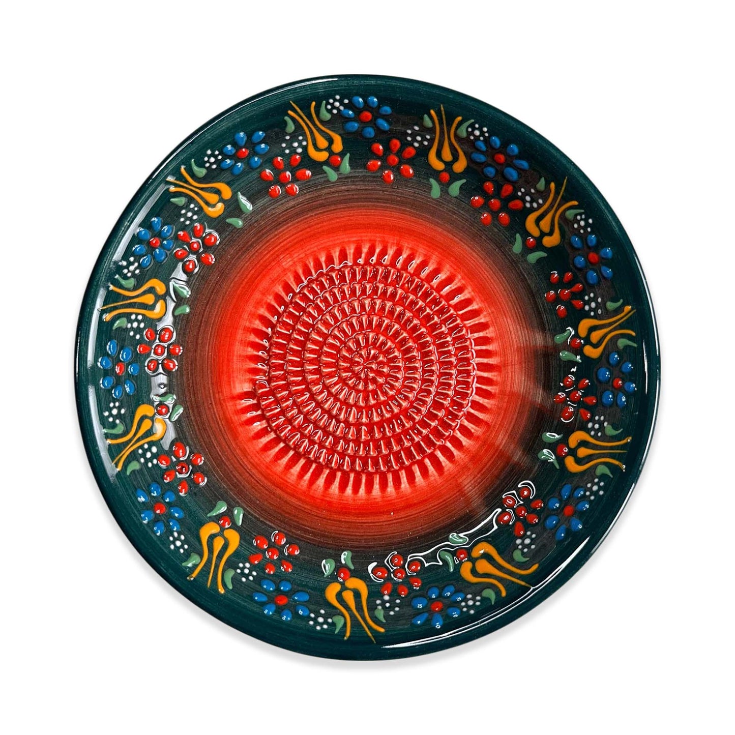 Decorative garlic grater bowl with a red center and colorful floral patterns on a white background