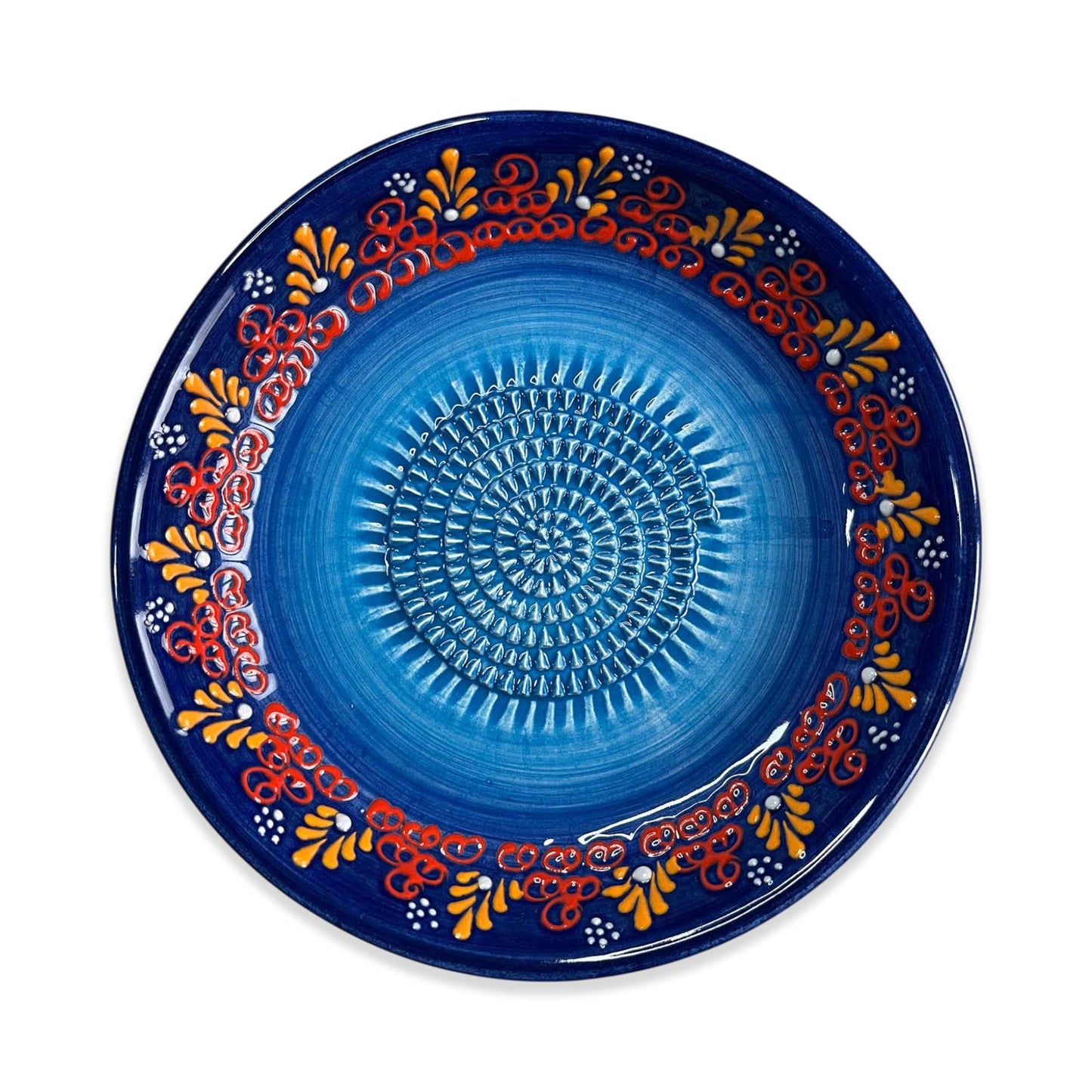 Decorative blue garlic grater bowl with colorful patterns on a white background