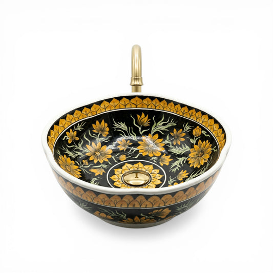 Decorative ceramic sink with floral patterns on a black background