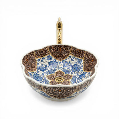 Decorative ceramic sink with floral patterns on a white background