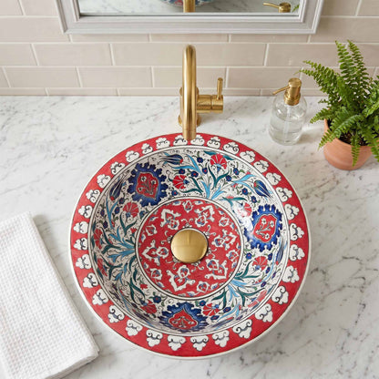 Decorative sink with floral pattern on a marble countertop