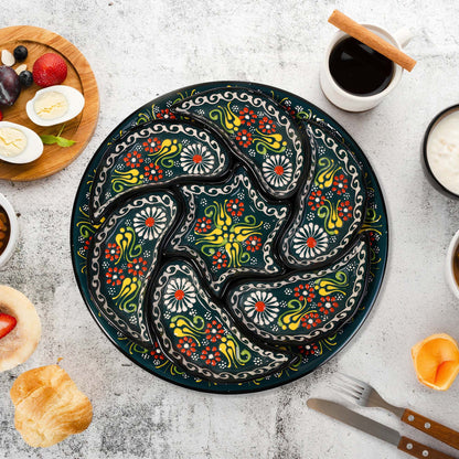 Decorative snack serving tray set with floral patterns on a table with food and coffee.