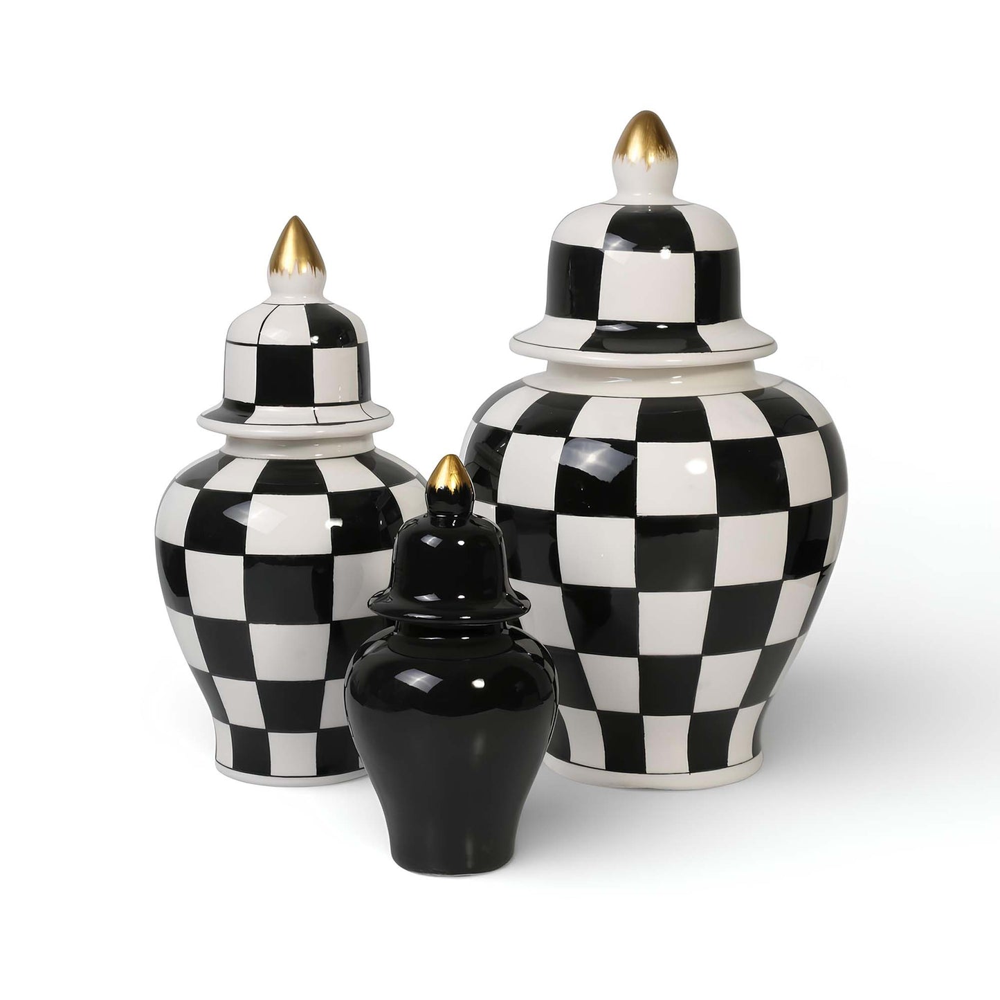 Set of three black and white checkered ceramic jars with gold accents on a white background