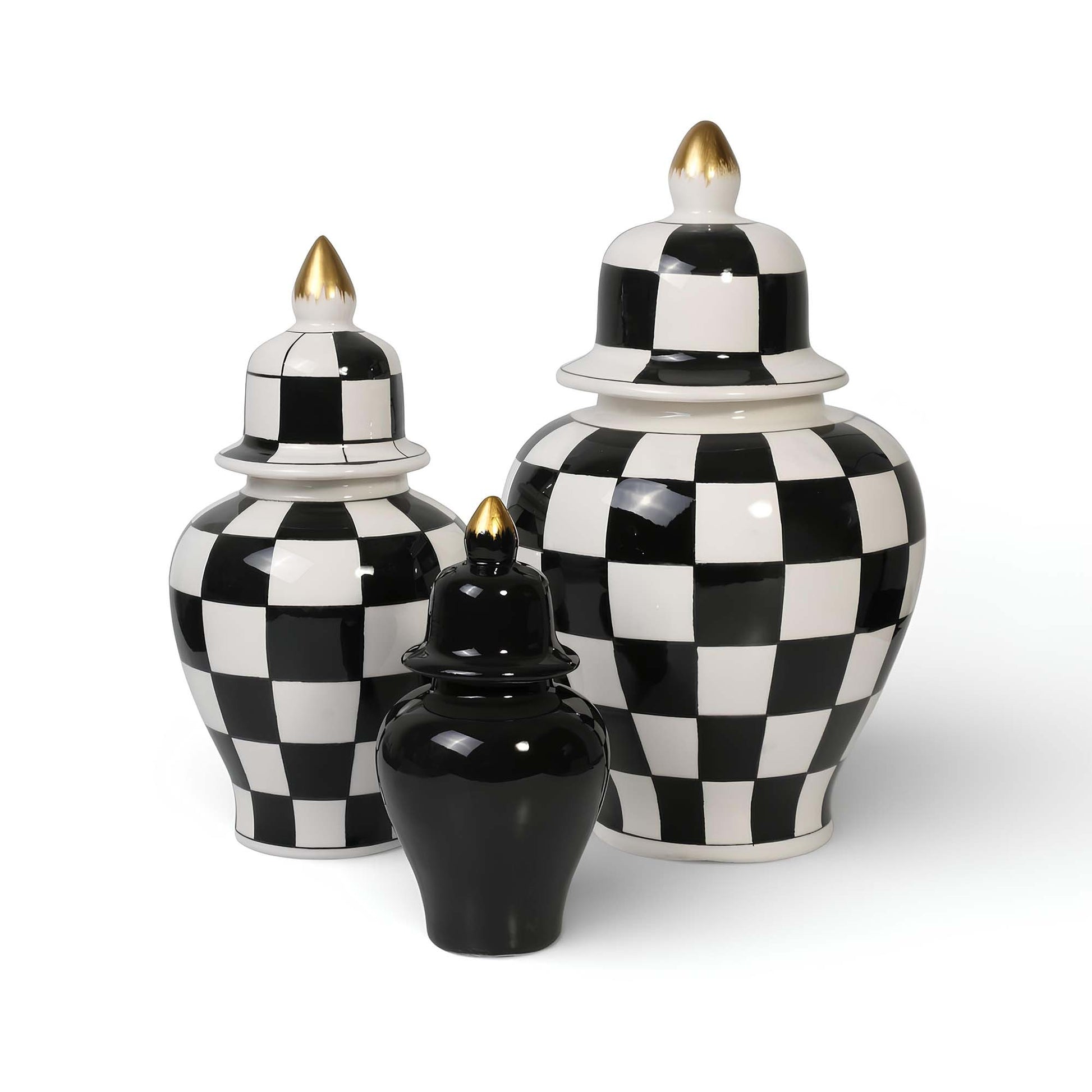 Set of three black and white checkered ceramic jars with gold accents on a white background