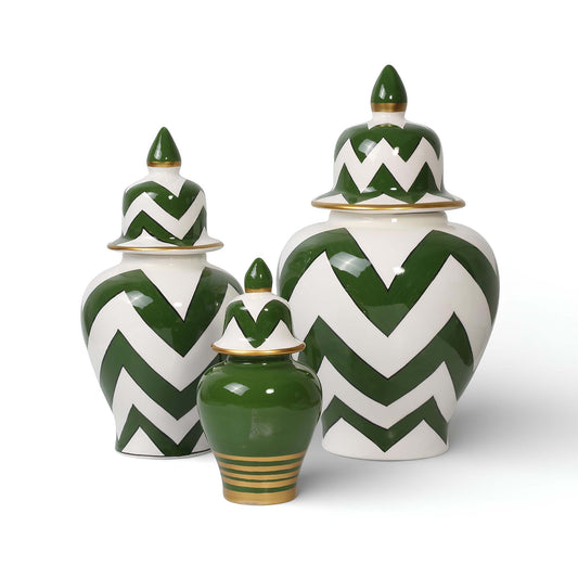 Set of three ceramic jars with green and white chevron pattern on a white background