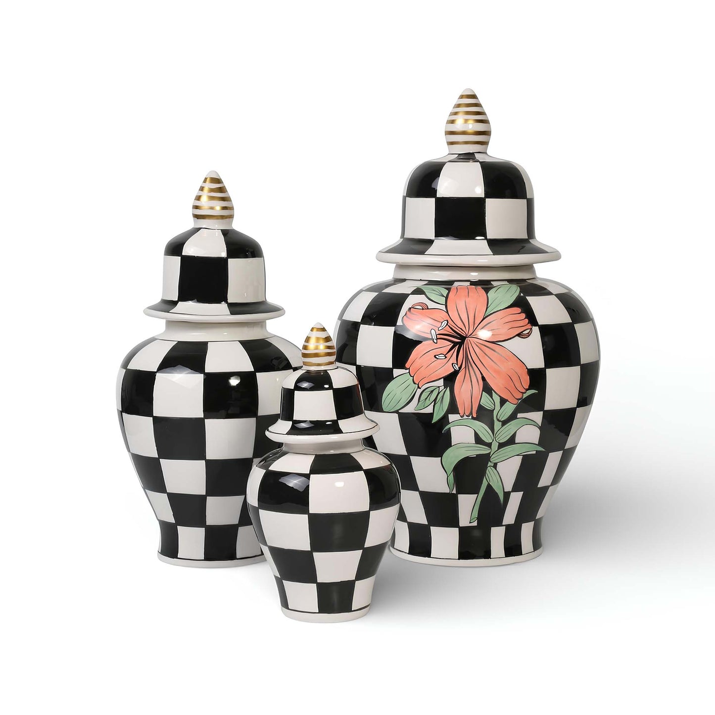 Set of three decorative jars with black and white checkered pattern and floral design on a white background