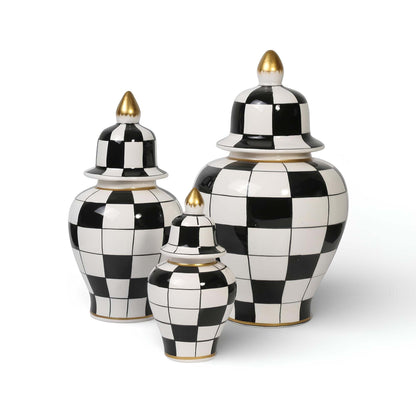 Set of three black and white checkered jars with gold accents on a white background