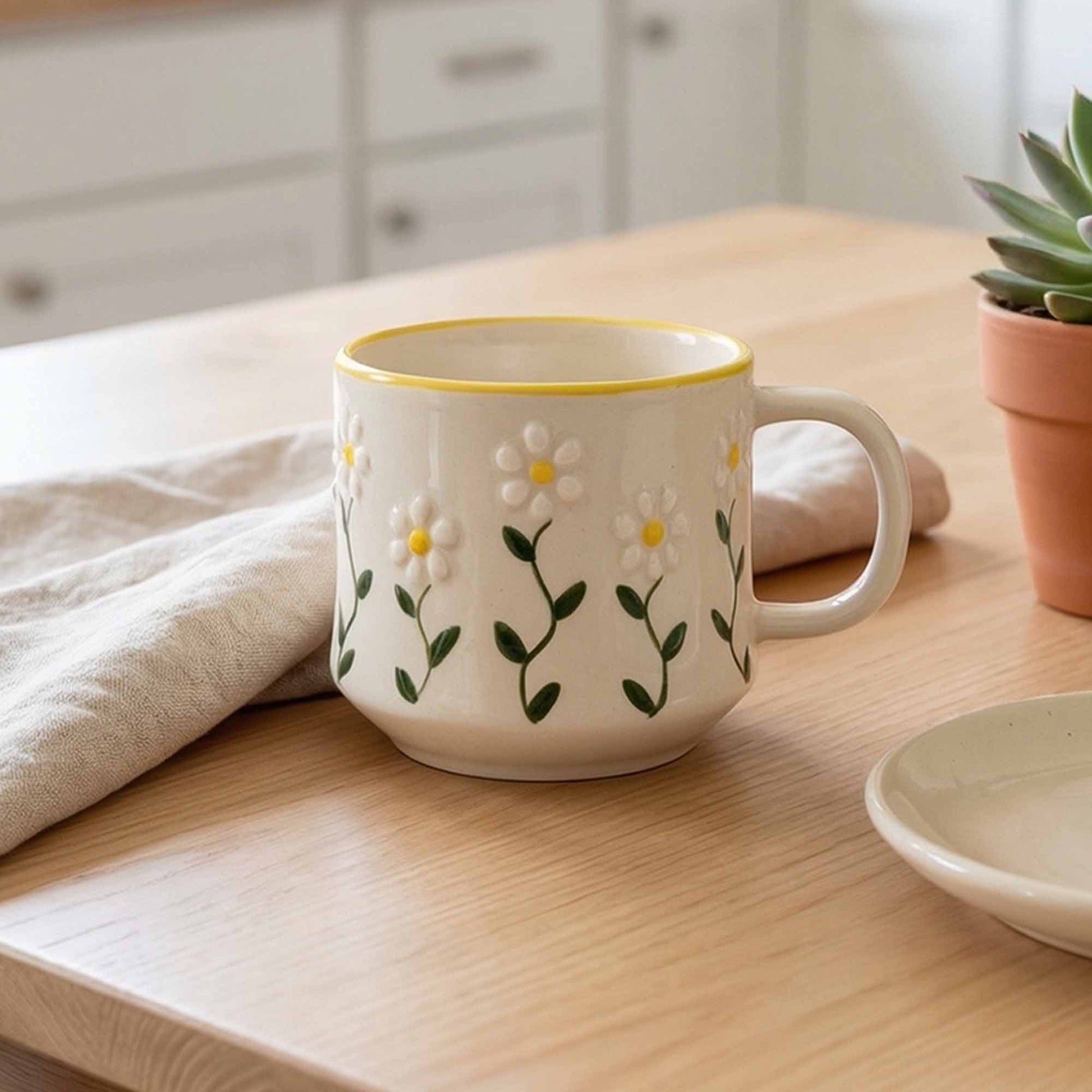 White mug with floral design on a wooden table